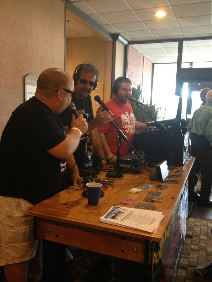 Hosts at the station table during a remote broadcast